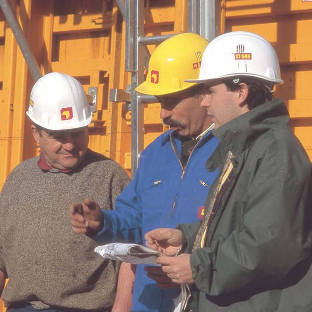 Photo of three SAE employees on a construction site